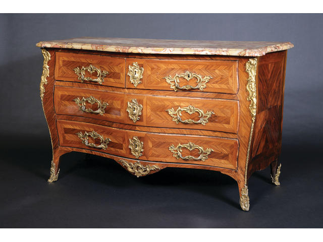 A French 18th century Louis XV ormolu-mounted kingwood and tulipwood serpentine commode