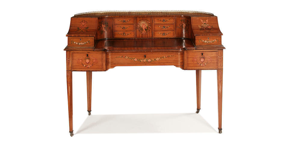 A George III style satinwood and polychrome decorated Carlton House desk