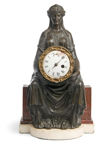 A 19th century French bronze and rouge griotte marble mantel clock