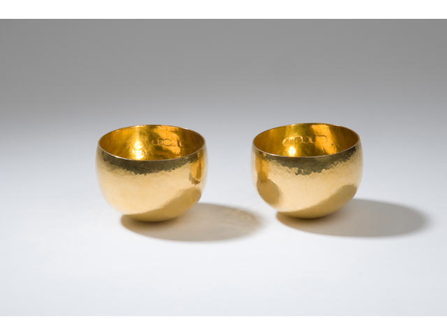 A pair of 22 carat gold cups by RNRG London 1973