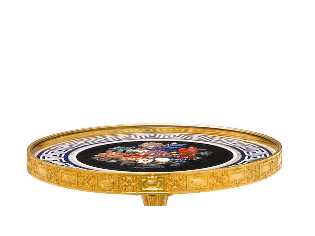 An Imperial Russian gilt-bronze centre table, the marble top with a lapidary relief bouquetImperial Lapidary Factory in Peterhof, design by Joseph August Satory (1803-1868), bronze mounts by Nichols and Plincke English Shop  1842