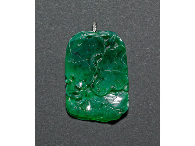 A jadeite pendant with diamond loop