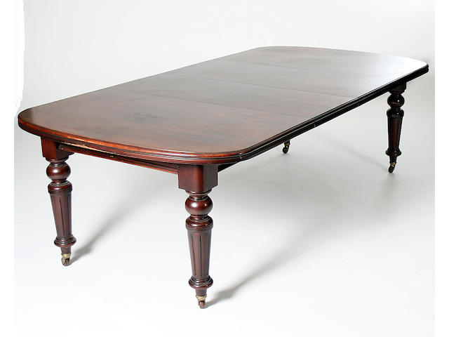 A late Victorian mahogany wind-out dining table