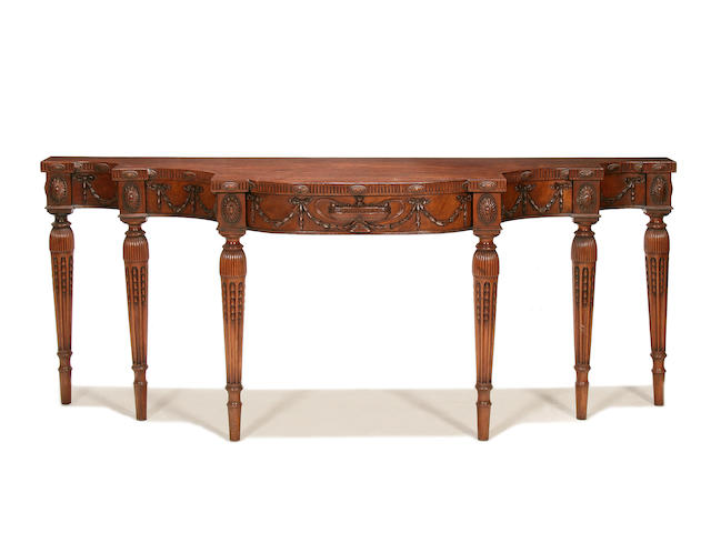 A large late 19th/early 20th century mahogany double breakfront serving table in the Adam revival style