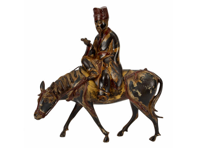 An 18th Century Chinese export painted bronze group of a sage on horseback