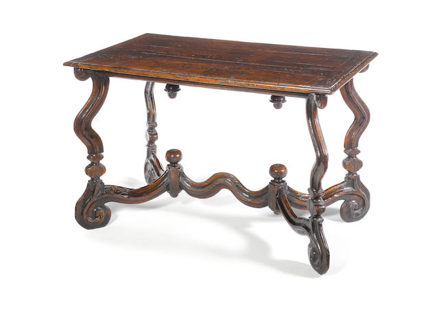 A Tuscan 17th century walnut centre table the table top possibly of later date