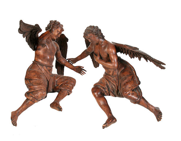 A pair of 19th century carved walnut figures of angels