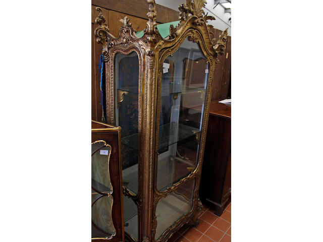 A 19th Century rococco style carved and gilt wood vitrine,