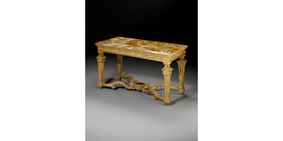 An impressive French 18th century Louis XIV giltwood console table with onyx top