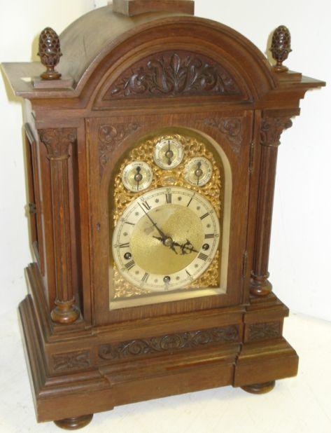 A late Victorian carved oak architectural style bracket clock, the brass dial with silvered chapter ring, chime/silent, slow/fast, chime on 8 bells/chime on 4 gongs, subsidiary dials, with substantial 8 day movement, fluted pilasters, on a moulded plinth base, 55cm.