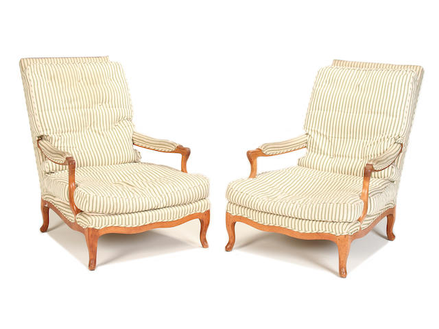 A pair of second quarter 20th century fruitwood armchairs