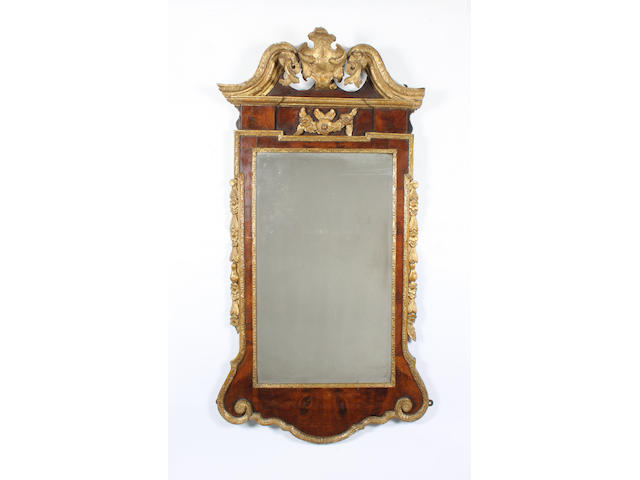 A good George II/III figured walnut and parcel gilt wall mirror or looking glass, in the manner of Thomas Aldersey of London