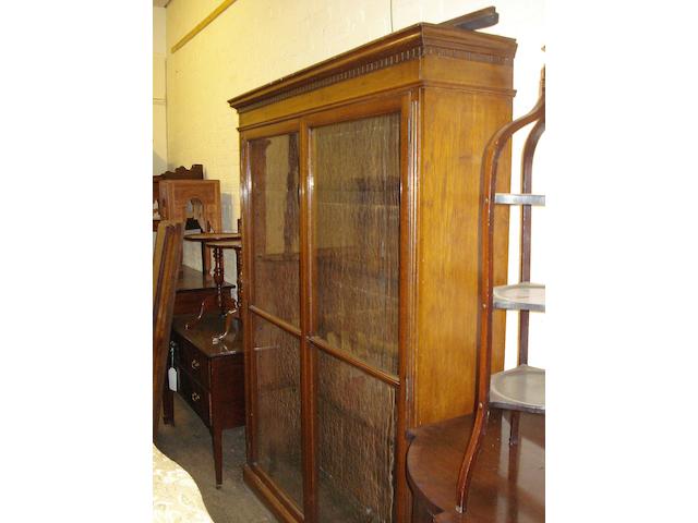 A large late Victorian oak and glazed bookcase