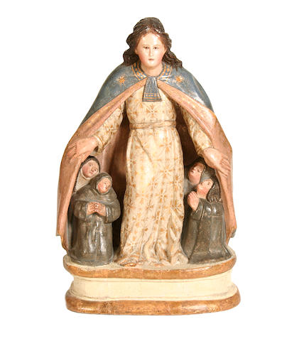 A 17th / 18th century Spanish carved wood and al estofado decorated figure of the Madonna of the Mercies