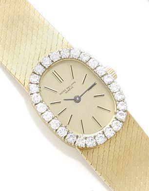 Patek Philippe. A lady's 18ct gold manual wind wristwatch with diamond bezelCirca 1990