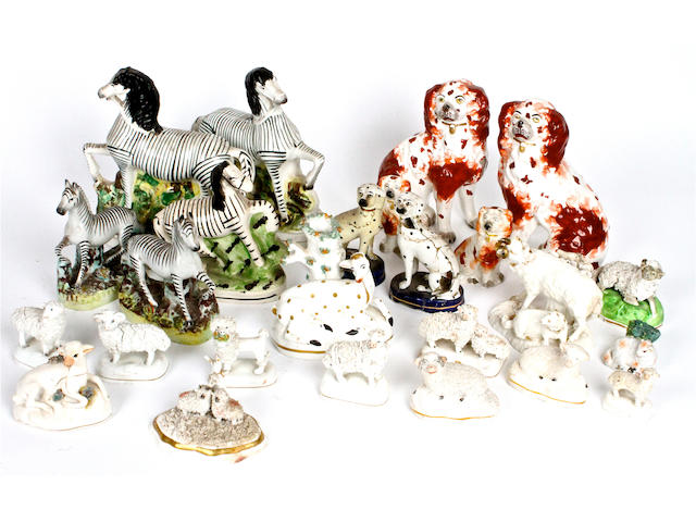 A small group of Staffordshire pottery animals