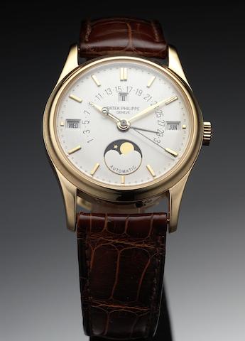 Patek Philippe. A fine and rare rose gold perpetual calendar wristwatch with retrograde date and phases of moon together with fitted Patek Philippe wooden boxRef:5050, Case No.2980976, Movement No.1957499, circa 1994