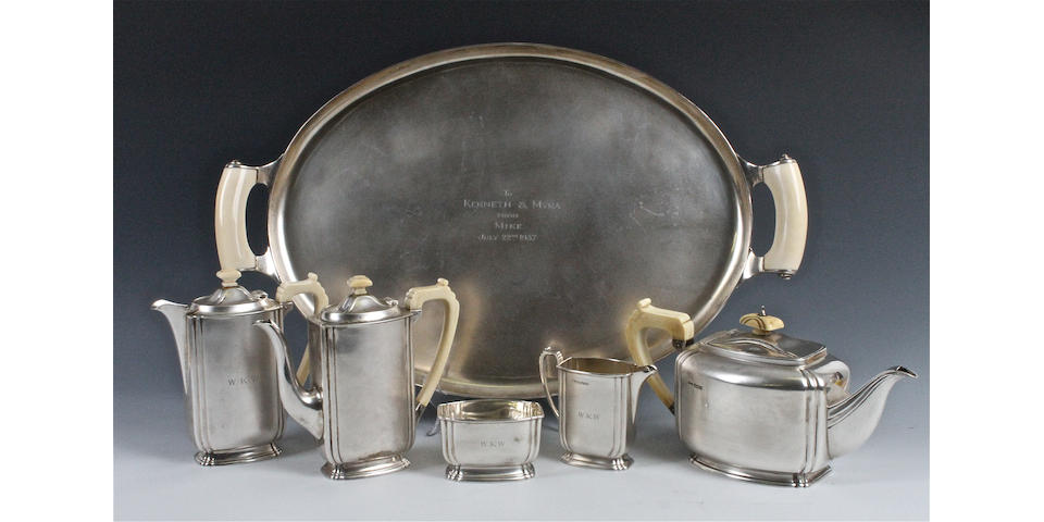 A silver five piece tea and coffee set with matched tray The tea set with maker's mark 'FC', Sheffield, 1935, the tray by Asprey and Co, London, 1936,  (6)