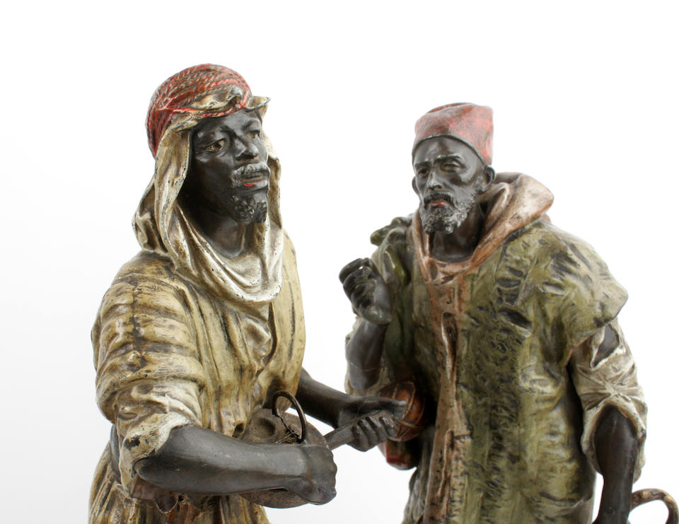A pair of cold painted figures of Arabs