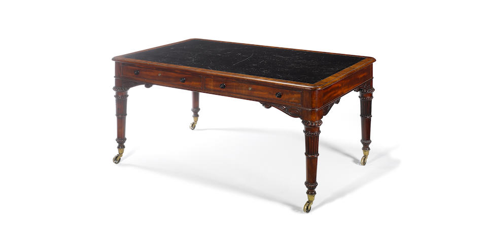 A William IV carved mahogany library table
