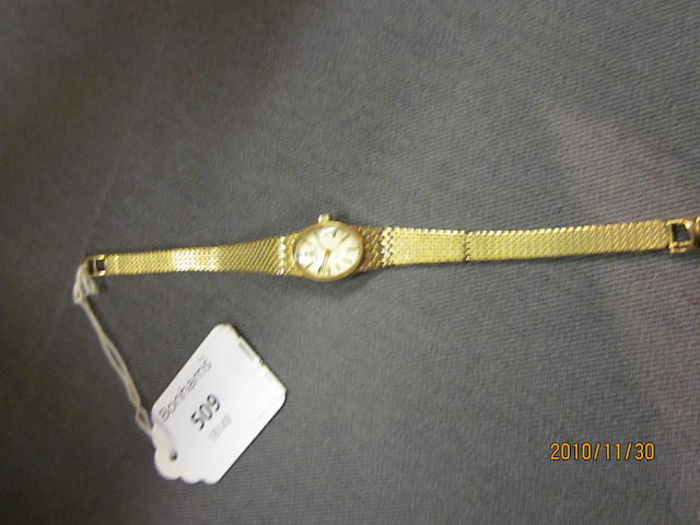 Omega: A 9 carat gold lady's bracelet watch,