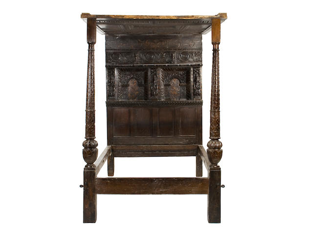 An Elizabethan oak and marquetry inlaid tester bed