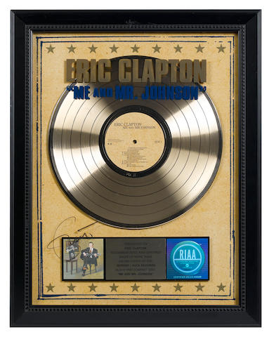 A presentation 'gold' sales award for the Reprise/Duck Records LP ME AND MR JOHNSON, RIAA certified &#8211; Presented to ERIC CLAPTON,