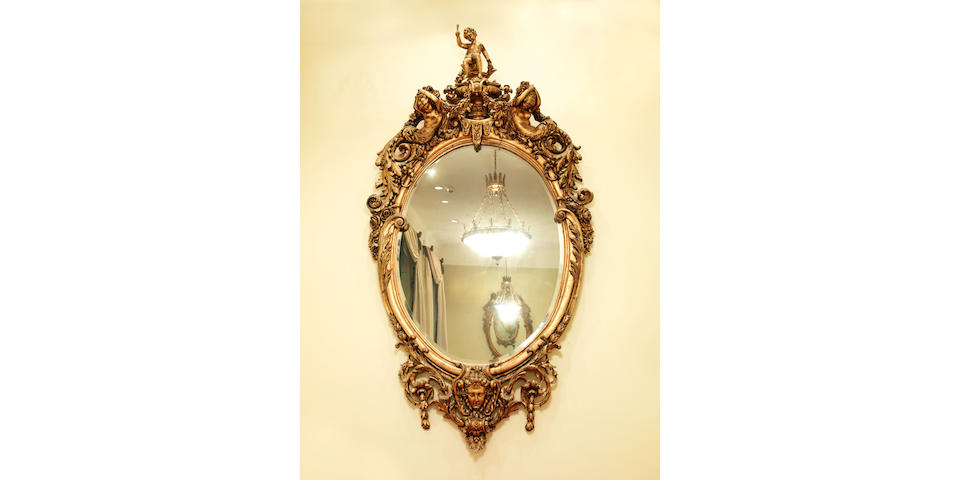 A large and impressive pair of carved giltwood pier mirrors in the French late 19th century style