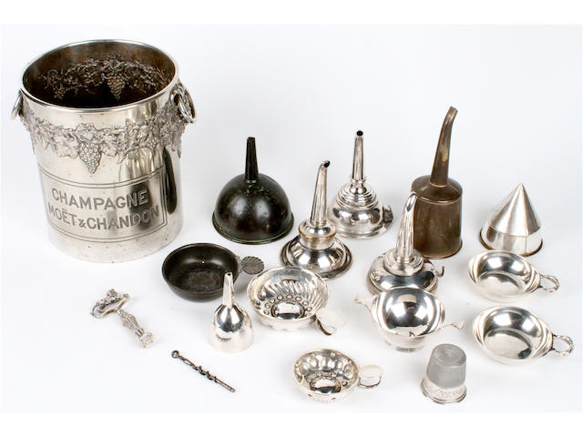 A group of silver wine related items