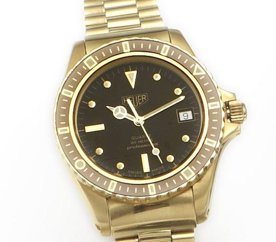 Tag Heuer. An 18ct gold quartz calendar bracelet watchCirca 1990