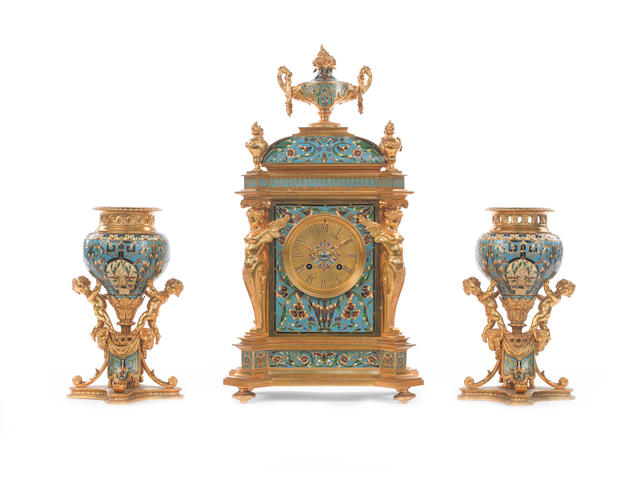 A good late 19th century French champlev&#233; enamel and gilt brass clock garniture