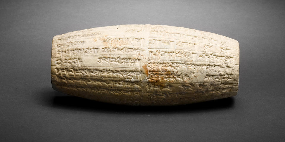 A Mesopotamian terracotta cuneiform cylinder
