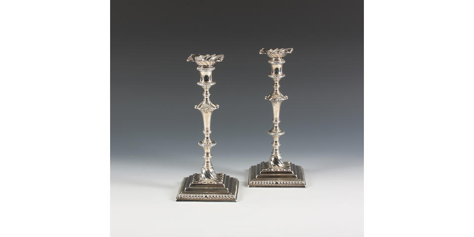 A pair of George III cast silver candlesticks By Ebenezer Coker, London, 1764,  (2)