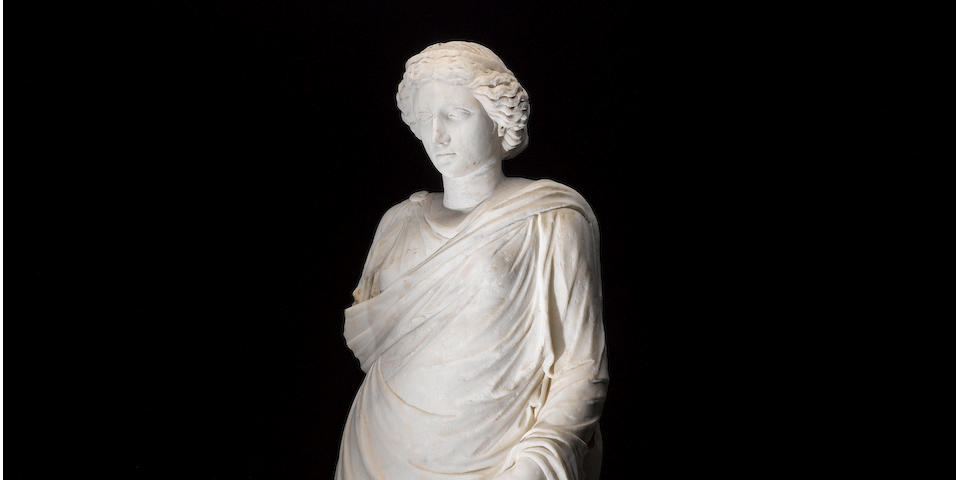 A Roman marble figure of a goddess
