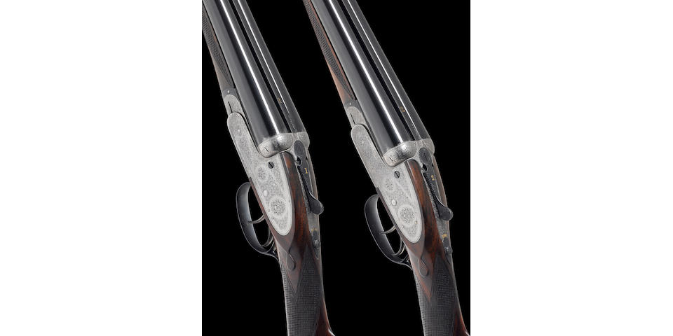 A fine pair of 12-bore (2&#190;in) self-opening sidelock ejector guns by H. Atkin, no. 2216/7 In their brass-mounted oak and leather case