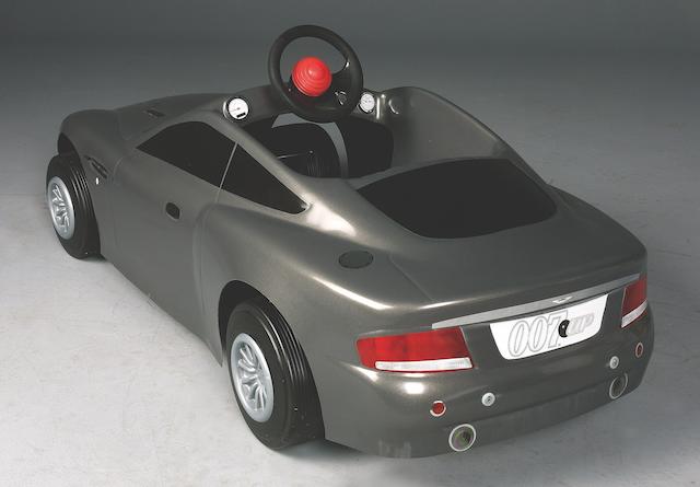 A rare 007-Up promotional Aston Martin Vanquish pedal car, American,