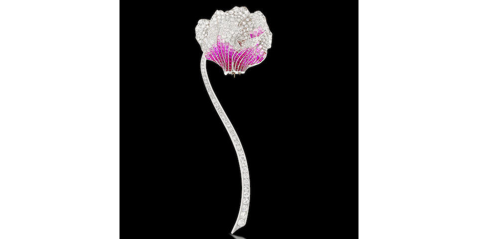 A fine pink sapphire and diamond flower brooch,