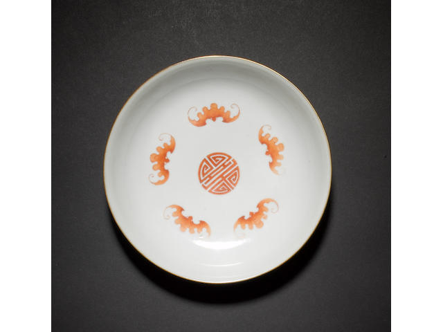 An iron-red and gilt 'bat' saucer dish Jiaqing seal mark and of the period