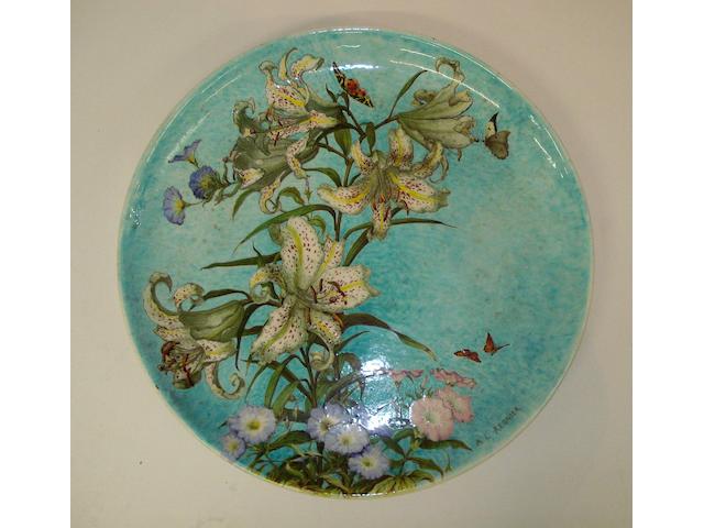 A large Theodore Deck faience 'Lilium' wall charger by A. L. Regnier Circa 1910