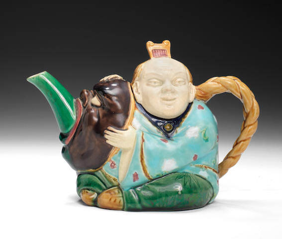A good Minton Majolica Japanese Actor teapot and cover, dated 1874