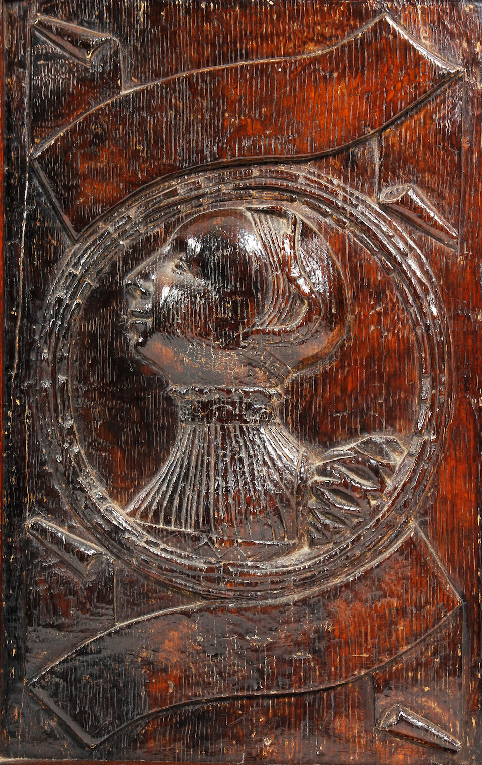 A superb set of four early Elizabethan carved oak 'Romayne' bust portrait panels Circa 1560, probably depicting members of the Stanley Family of Hooton Hall, Wirral