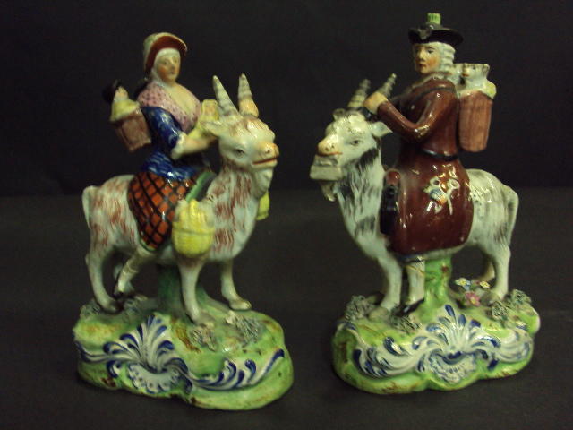 A pair of Staffordshire pearlware figures of the Welch Tailor and his wife