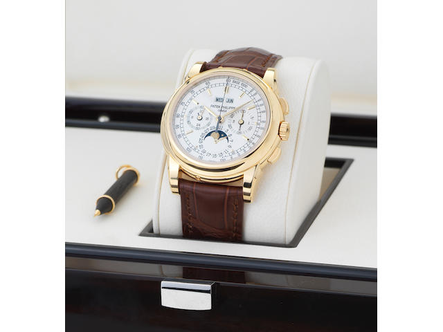 Patek Philippe. A fine and rare 18ct gold perpetual calendar chronograph wristwatch with moon phases and together with Certificate of Origin and spare backRef:5970J, Case No.4462754, Movement No.3049582 Sold 31st October 2008