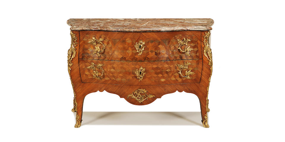 A Louis XV gilt metal mounted kingwood, tulipwood and bois satin&#233; parquetry serpentine commode made by L. Boudin