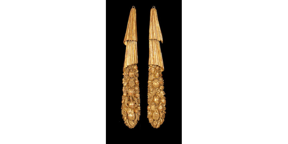 A large pair of Regency carved giltwood hanging swags