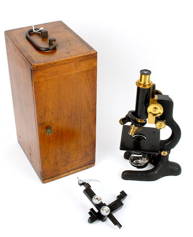 An early 20th century walnut cased monocular microscope by Bausch & Lomb Optical Co.