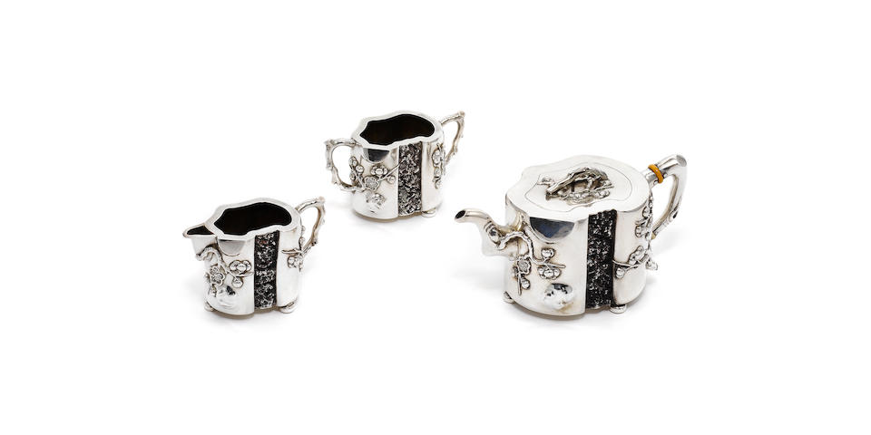 A Chinese export silver three-piece tea service, stamped with character marks,  (3)