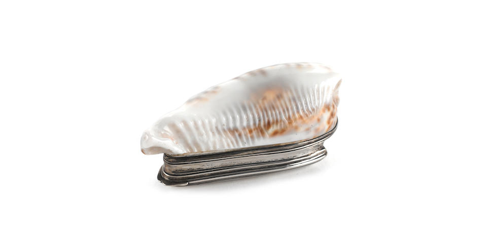 An 18th century Irish Provincial silver-mounted cowrie shell snuff box, maker's mark only, probably Stephen Mackrill, circa 1760-80,