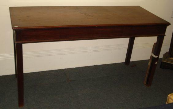 A George III style mahogany serving table, 19th Century and later, the moulded rectangular top above a plain frieze, on square chamfered legs, 153cm.