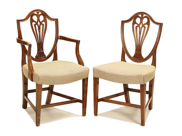 A set of eight late George III mahogany dining chairs